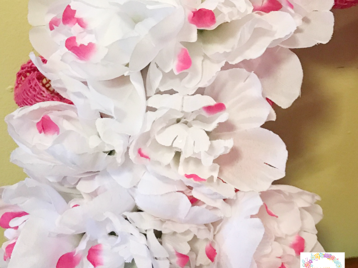 Adding Peonies to spring burlap wreath from the dollar store