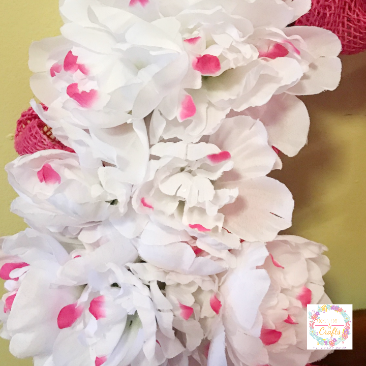 Adding Peonies to spring burlap wreath from the dollar store