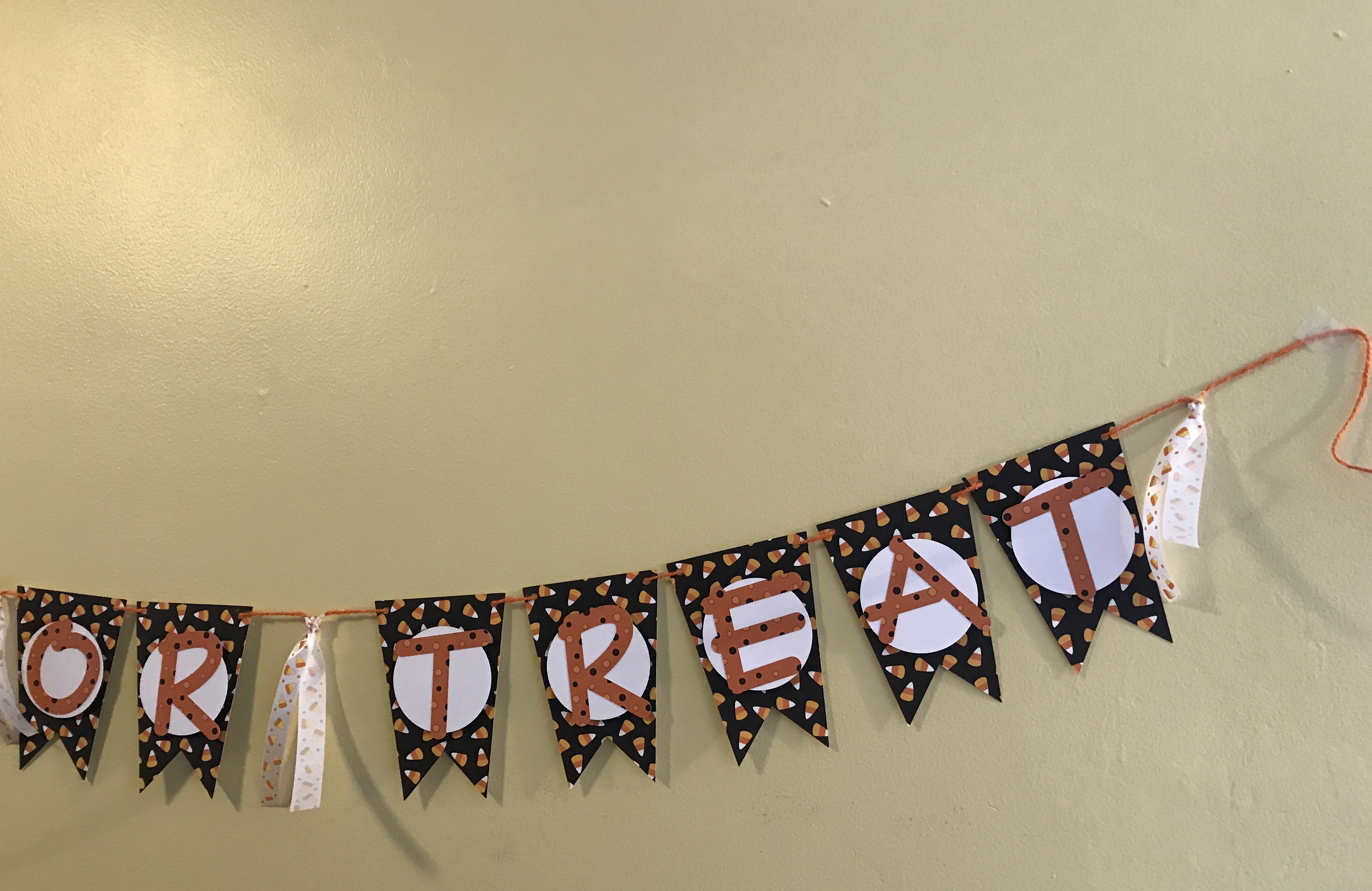 Trick or Treat Banner hanging with matching candy corn ribbon
