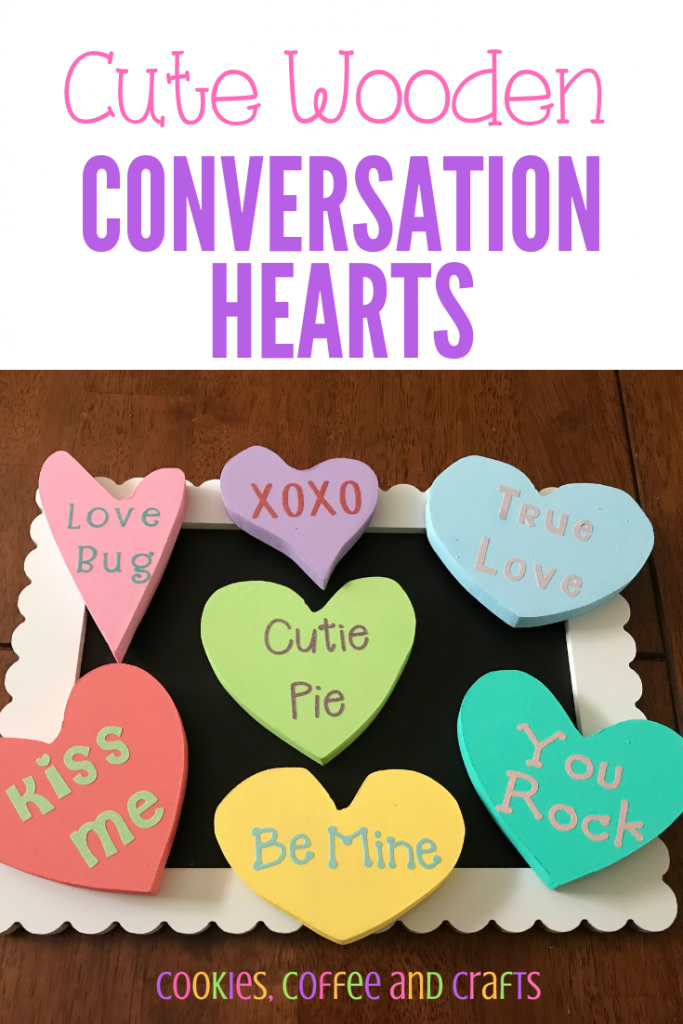 Conversation hearts are a huge part of Valentine's Day so add some to your decorations with these easy DIY wooden hearts. The kids will love painting them as a craft project. They look great as a centerpiece on the table and add romance to your table setting. #ValentinesDay #valentines #Valentinesdecorations #DIY #ValentinesDayCraft