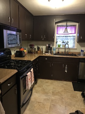 Removing laminate from the kitchen cabinets to create a farmhouse kitchen with shaker style cabinets