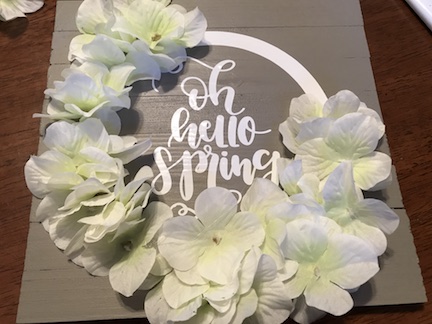 A Spring Farmhouse Kitchen Sign with flowers. Learn how to make this simple sign for $3 using the Cricut Maker and vinyl