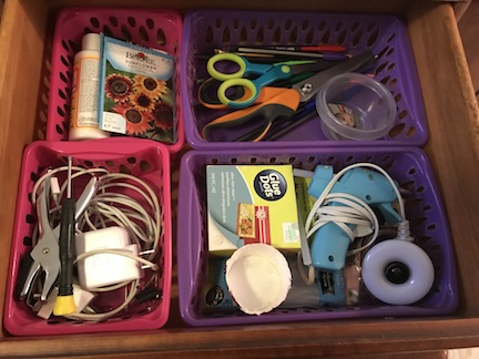 Organize your craft drawers with baskets and crayon boxes from the dollar store. 