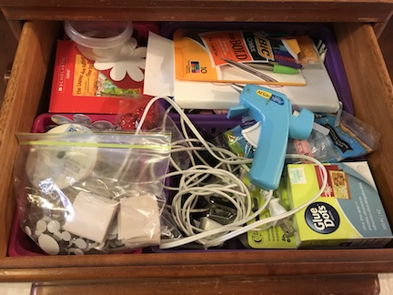 Organize your craft drawers with baskets and crayon boxes from the dollar store. 