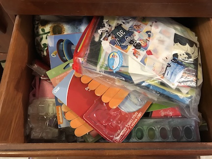Organize your craft drawers with baskets and crayon boxes from the dollar store.