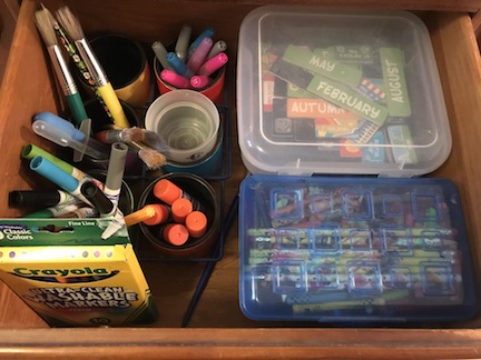 Organize your craft drawers with baskets and crayon boxes from the dollar store. 