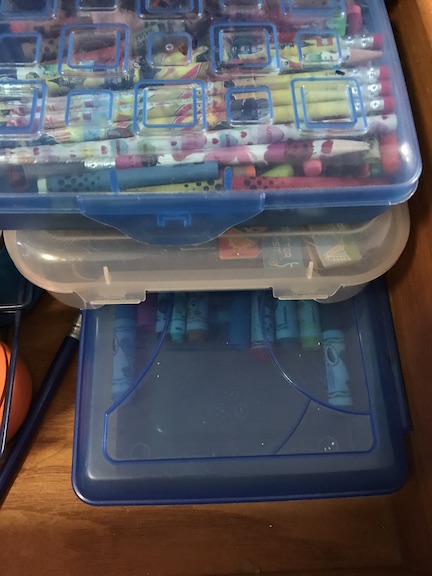 Organize your craft drawers with baskets and crayon boxes from the dollar store. 