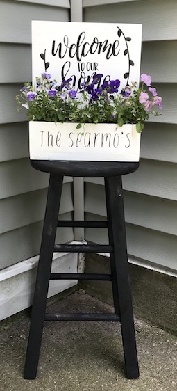 I found this old stool out for trash and gave it a second chance. Find out how I made a farmhouse stool to decorate by my door.  #farmhouse #stool #DIY #upcycle #homedecor #porchdecor #farmhousestyle #Planter #flowers 