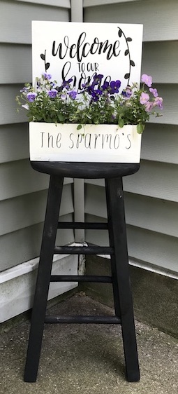 I found this old stool out for trash and gave it a second chance. Find out how I made a farmhouse stool to decorate by my door. #farmhouse #stool #DIY #upcycle #homedecor #porchdecor #farmhousestyle #Planter #flowers