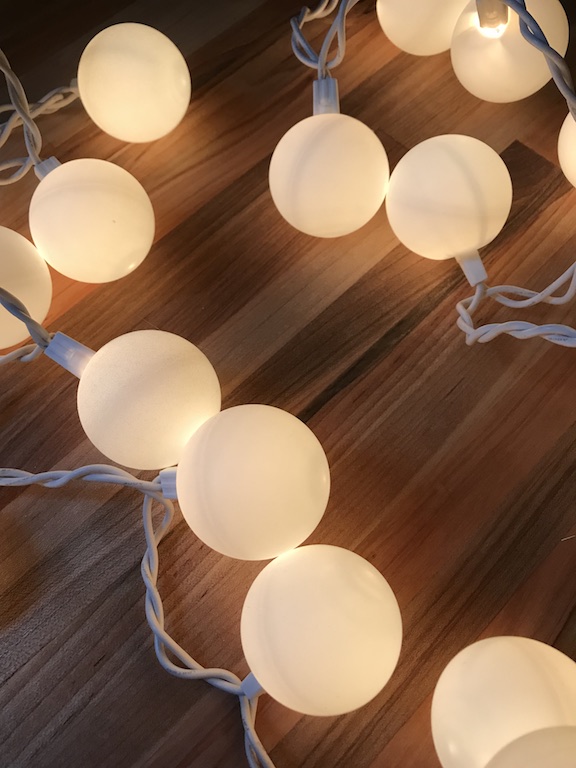  Ping Pong Ball Lights are easy and fun to make. Learn how to make these spooky halloween Jack Skellington lights. The kids and adults will love the design and creativity. #JackSkellington #NightmareBeforeChristmas #PingPongBalls #DIY #Kids #Fun #HowtoMake #HalloweenParty #Halloween #HalloweenDecor #HalloweenIdeas #Vinyl #CricutMade 
