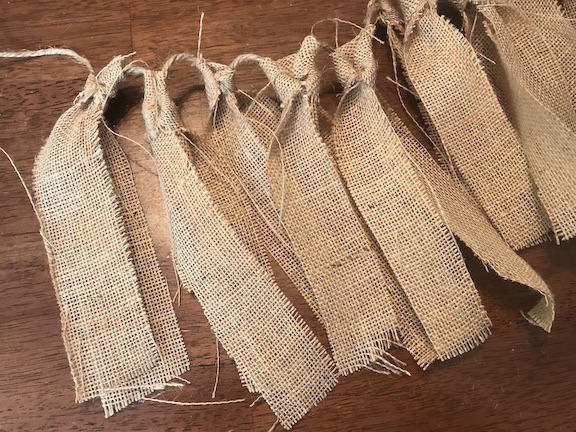 The kids will love counting down the days until Christmas with this candy cane and burlap countdown garland. The children will love eating a candy cane everyday waiting for Santa to come. Follow this easy DIY and create this fun craft. #CandyCane #Burlap #Garland #Christmas #ChristmasIdeas #ChristmasDecor #ChristmasGarland #Kids #ChristmasCountdown #Xmas