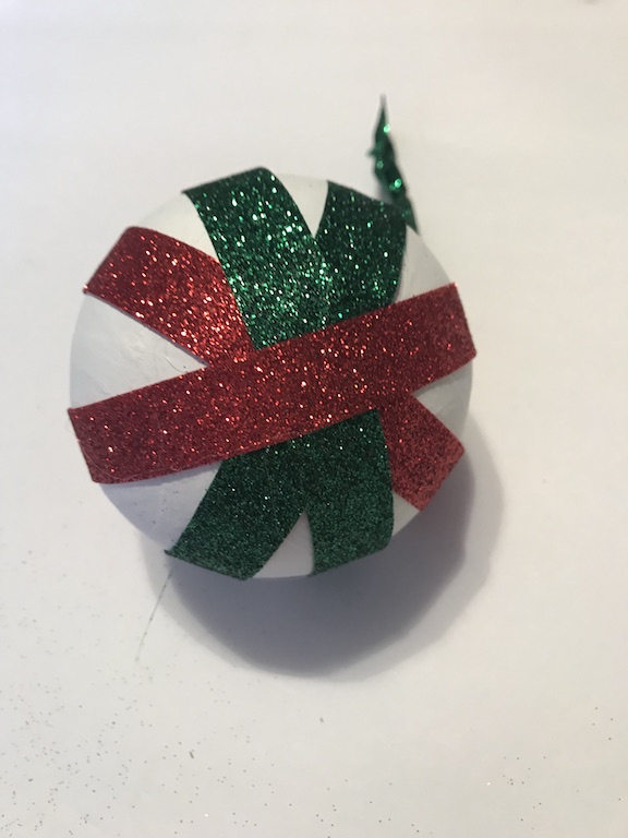 Glittery Ribbon Christmas Ornament from the Dollar tree is an easy and sparkly craft idea