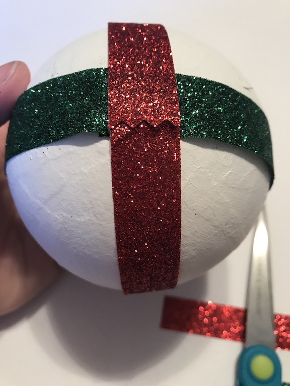 To create the DIY Ribbon Christmas Ornament just wrap it around and hot glue the ribbon