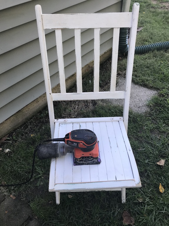 Sanding the Wooden Chair to get it ready to paint black for Halloween 