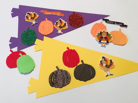 Help toddlers, preschoolers or Kindergarteners learn about fall by creating an easy Kids Fall Pennant. Celebrate autumn with thie fun idea that will make a great class decoration. #fallcrafts #KidsCrafts #fallcraftsforkids #pennants 