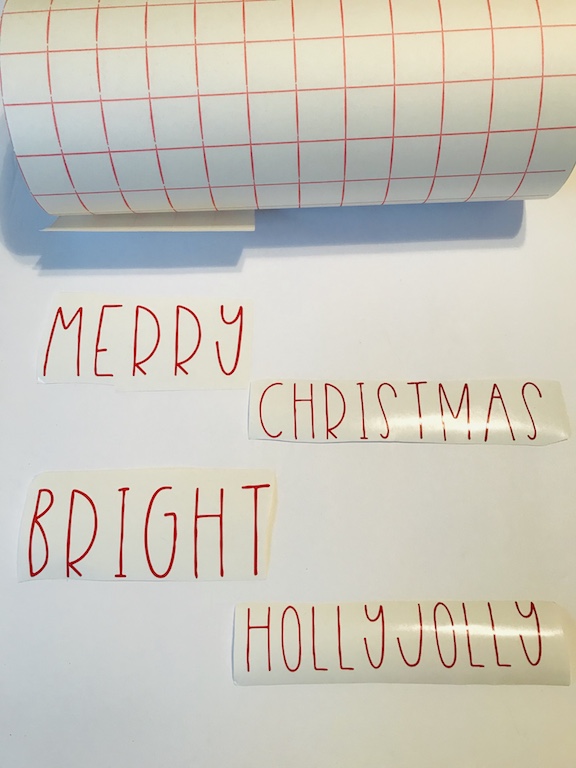 Words in red vinyl for the Rae Dunn Inspired Christmas Signs  