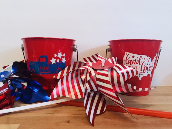 Celebrate the 4th of July with these fun 4th of July Party decorations. These buckets are perfect for a party, the table, house, or as cheap centerpieces. Decorate them with your Cricut and celebrate America with red, white, and blue. Great for any patriotic holiday. #CricutMade #4thofJuly ##4thofJulydecoration #Party #Centerpieces #DIY 