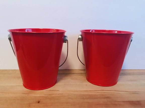 Celebrate the 4th of July with these fun 4th of July Party decorations. These buckets are perfect for a party, the table, house, or as cheap centerpieces. Decorate them with your Cricut and celebrate America with red, white, and blue. Great for any patriotic holiday. #CricutMade #4thofJuly ##4thofJulydecoration #Party #Centerpieces #DIY