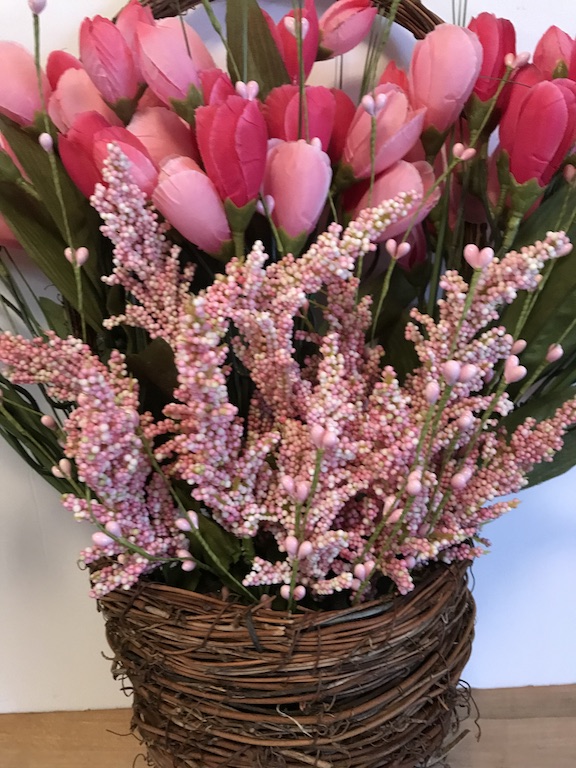 Pretty pink tulips and beads in the spring wreath for the front door