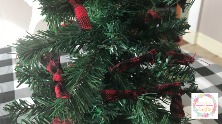 Adding ribbon to dollar tree Christmas Tree DIY Project 