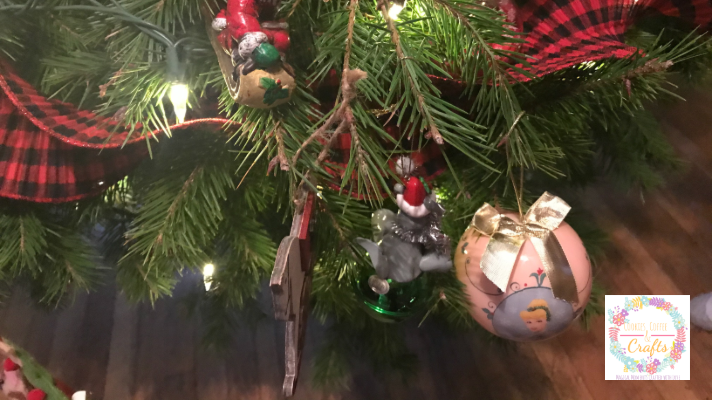 Kids decorating the tree with all the ornaments in one place