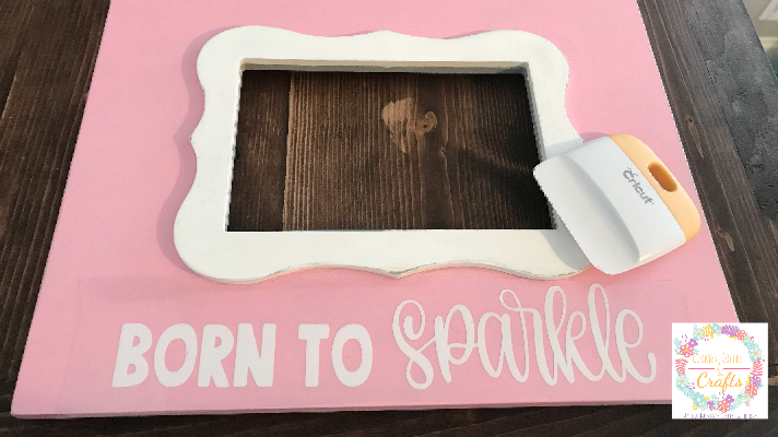 Adding the quote born to sparkle in vinyl on baby girl picture frame