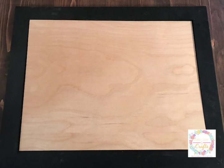Cut a piece of plywood to fit inside the picture frame for an easy DIY farmhouse sign