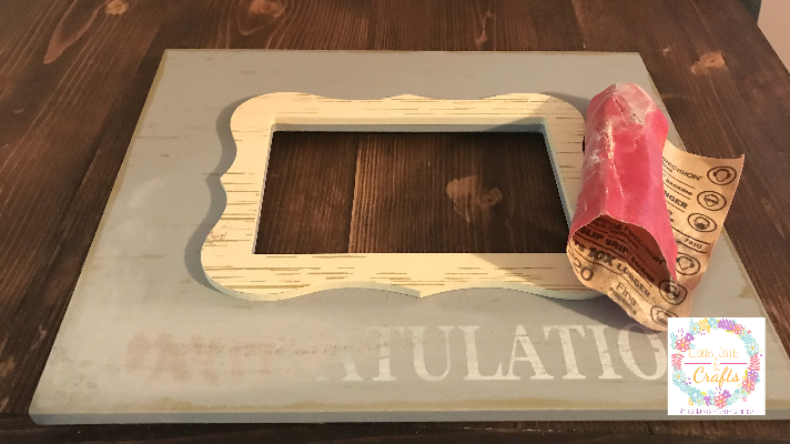 Sanding the picture frame to makeover into a baby girl picture frame idea