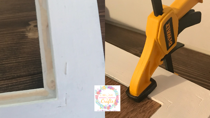 Using wood glue and clamps to glue the wooden sign into the picture frame 