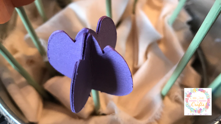 Fill the metal bucket with scrap fabric to the top