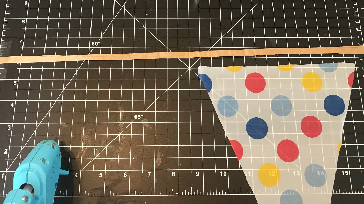 Creating banners for the back of the car with tablecloths, ribbon, and hot glue