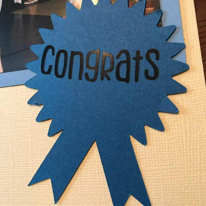 Adding Cricut Made designs to the kids scrapbook page for graduation