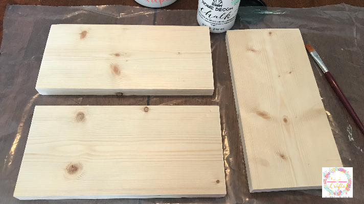 Painting the patriotic book stack with chalk paint