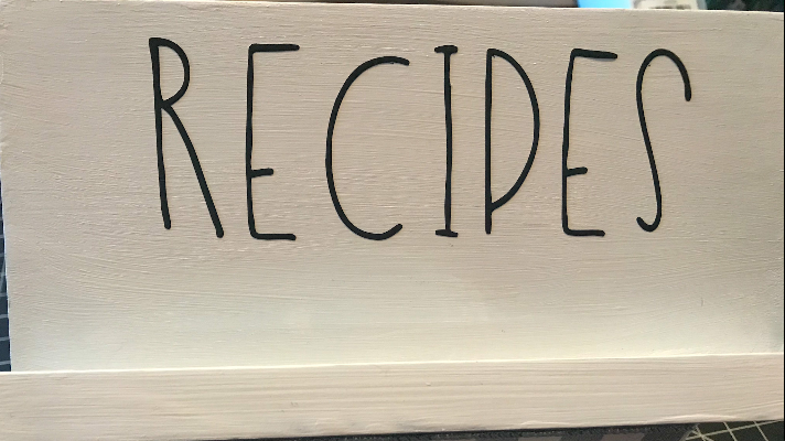 Adding the word recipes to the top of the wood recipe box 