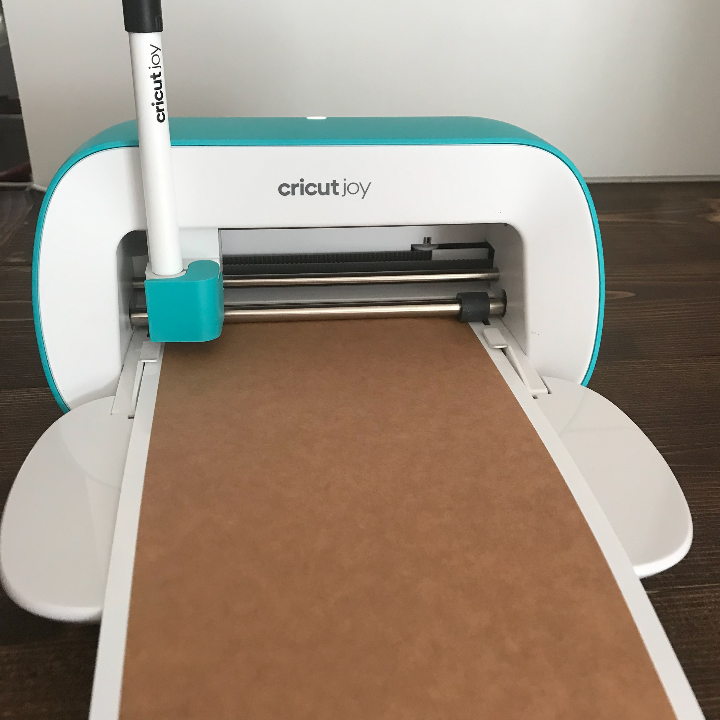 Cricut Joy writing on table paper to make planner stickers