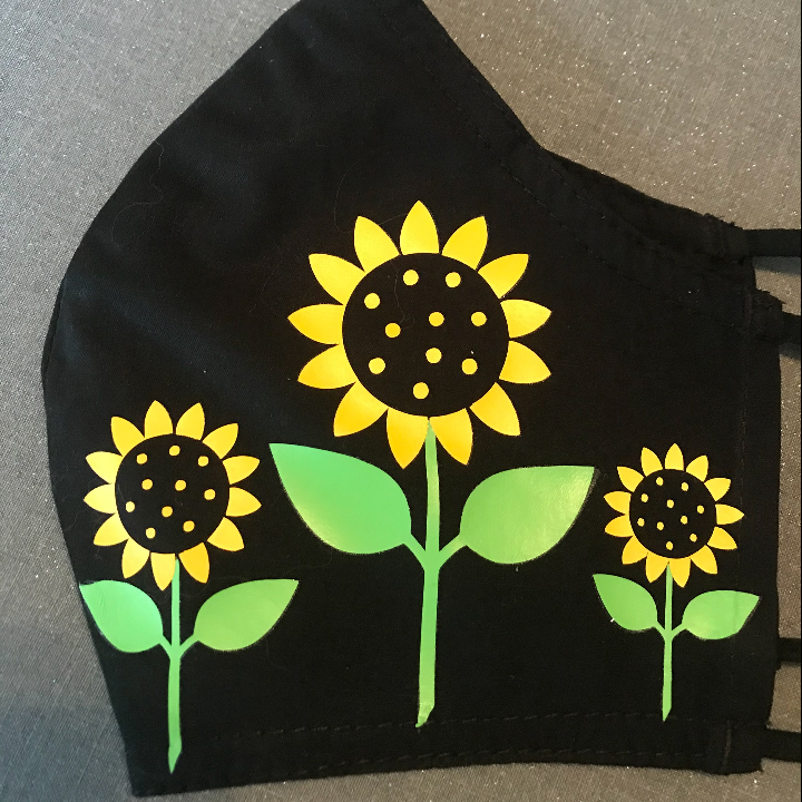 Sunflower face mask with heat transfer vinyl and Cricut Mini easypress