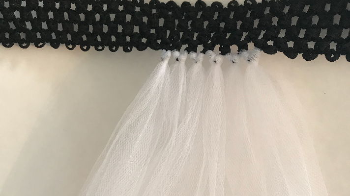 Tying the tulle to the waist band 
