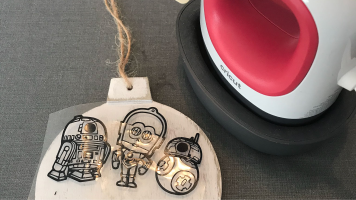 Using the Cricut Easypress mini to iron on wood to a Star Wars Christmas Ornament