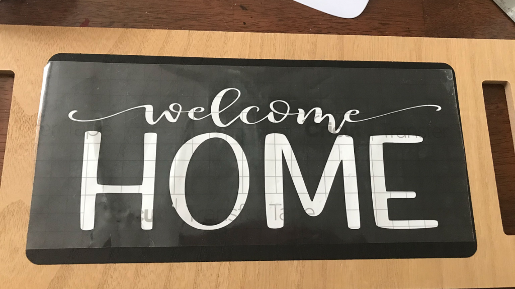 Lay the transfer tape on the sign to position it