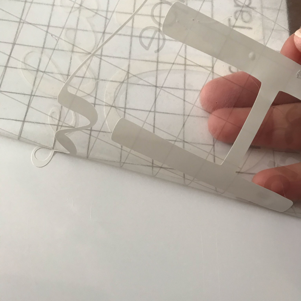 Pulling up the Smart Vinyl onto the transfer tape to make the sign