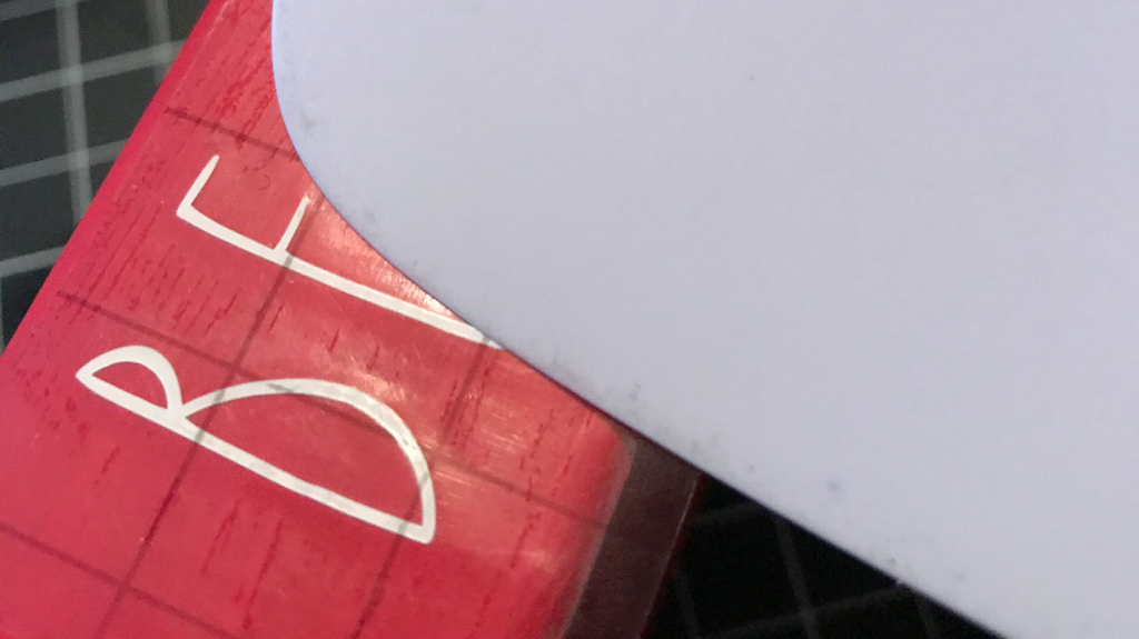 Using transfer tape to add the smart vinyl to the 2x4 book stack