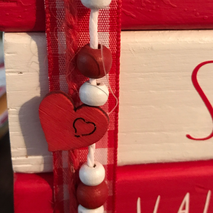 Valentine trim on mini book stack for decoration