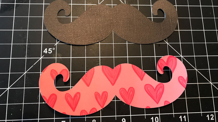 using decorative paper and card stock for the photo props with Cricut