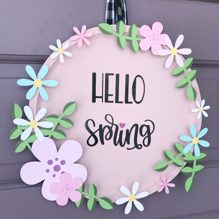 Spring Pizza pan wreath hanging on the front door