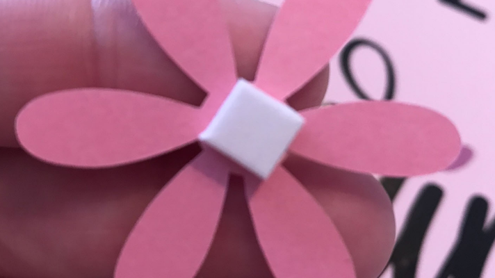 Using 3D foam tape to add the flowers to the pizza pan