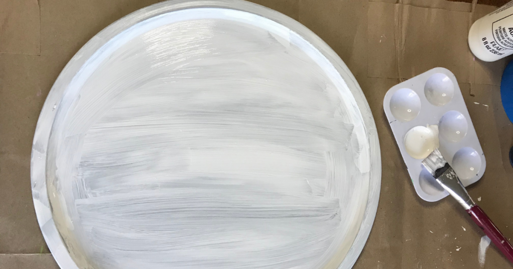 Paint the pizza pan tray craft idea with 3 coats of white craft paint