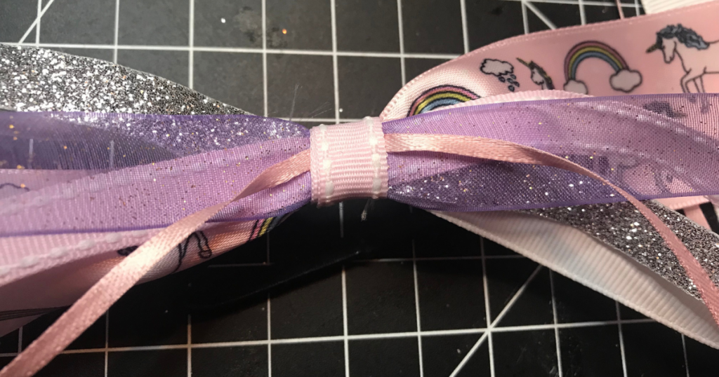 Finish the easy to make DIY girls hair accessories by adding ribbon around 