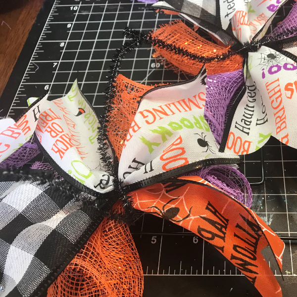 Repeat this step all the way around the dollar store Halloween ribbon wreath