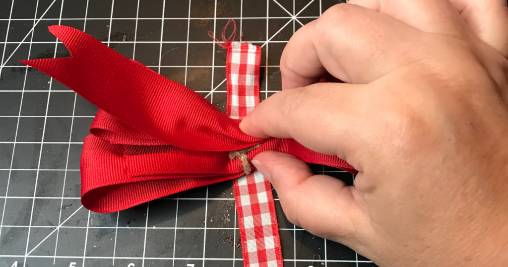 Putting the double stacked hair ribbon together with hot glue gun