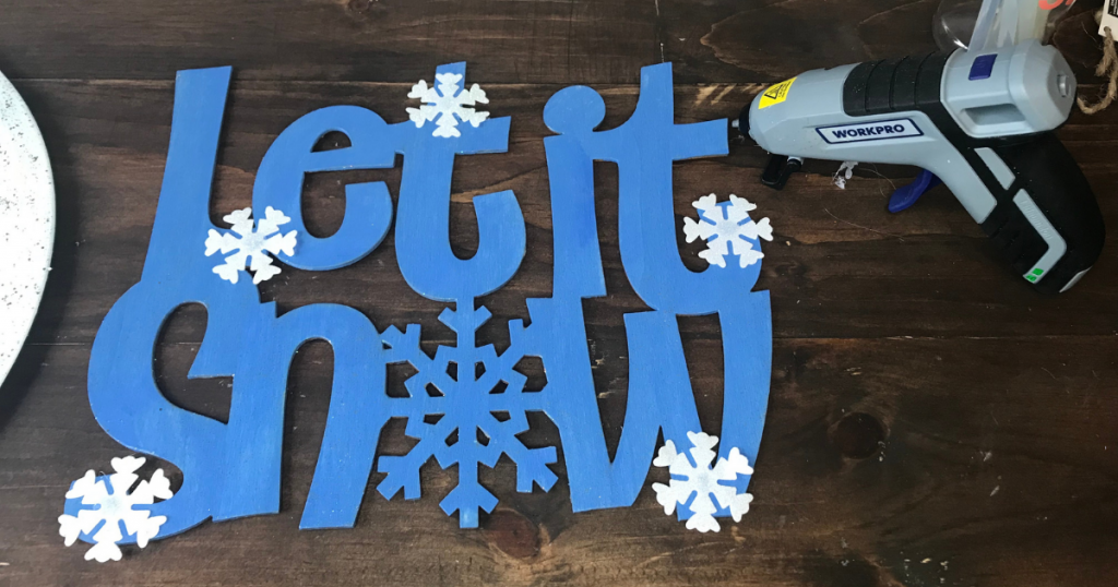 Hot glue snowflakes to the craft